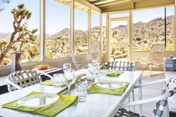 Screened porch with amazing view of Joshua Tree National park.  