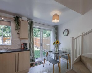 A dining area with a view of the outdoors.