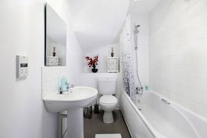 A well-polished bathroom you can use and can enjoy a relaxing bath in the bath tub.