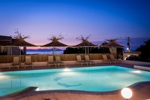 Dive into our pool and savor the breathtaking sunset