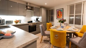 The kitchen has everything you need for a self catering getaway. Includes induction hob, oven, microwave, toaster, dishwasher, fridge/freezer and coffee machine (coffee pods provided.)