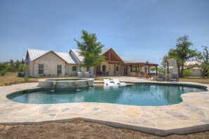 Embrace relaxation in the stunning pool and hot tub area.