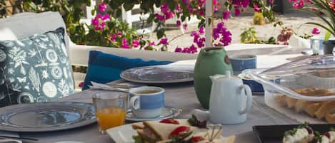 Arcana's famous & delicious homemade breakfast is served daily at your terrace