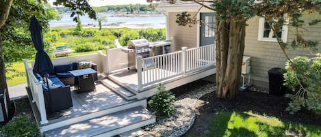 Main Entry with grill, wet bar, firepit and seating area.