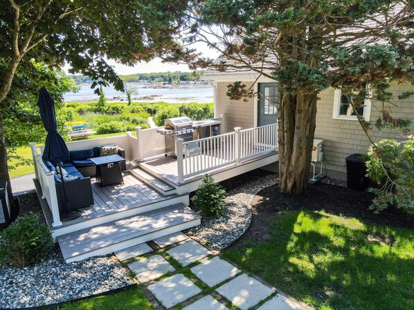 Main Entry with grill, wet bar, firepit and seating area.