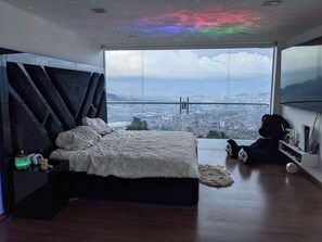 Room #1 - memory foam bed, 2 balconies (1 with city view, the other with full view of the pull), private en-suite bathroom, walk-in closet, smart code access, LED lights around bed, 85" TV w/ Netflix
