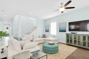 Comfy seating with large flat screen tv creates an awesome space for family time