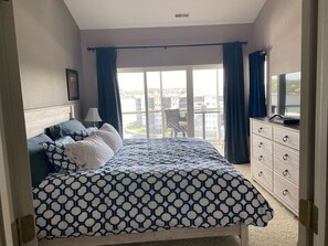 Master bedroom with king size bed and walkout patio. 