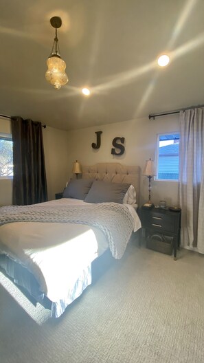  Master bedroom with en suite featuring double vanity and large rainfall shower.