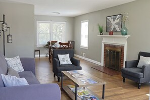 Living Room with fireplace and open dining area