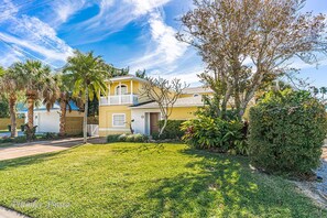 Ohana House has a large front yard that is set back from the road.