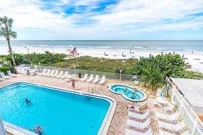 View of pool and lounging area