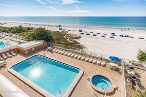 View from condo of pool and lounging area