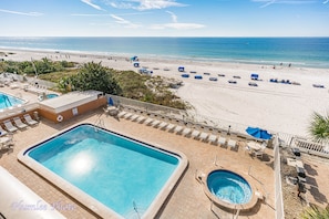 View from condo of pool and lounging area