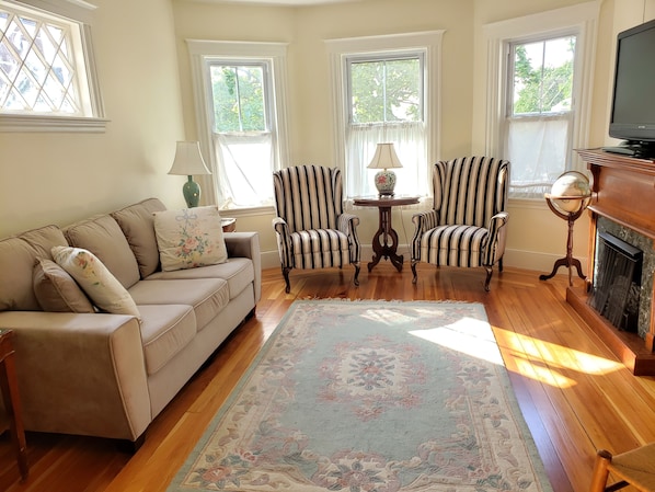 Beautiful Sun-Drenched Living Room with Bay Windows,  
