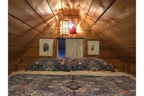 The sleeping loft with queen mattress.