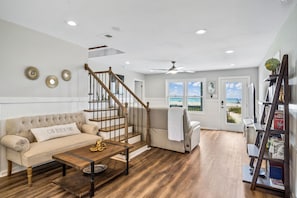 Main level, open layout, living area, and direct ocean access.