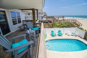 Relax on the deck overlooking the pool and ocean