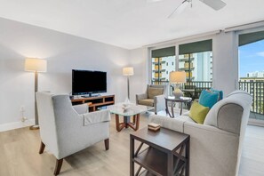 A large flatscreen TV with DirecTV programming is in the main living area.