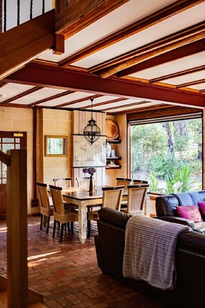Large open living space with lounge and dining areas