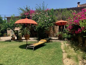 Garden with sun loungers, BBQ, dining area and plenty of space to relax