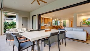 The private lanai offers outdoor dining, casual seating, and an outdoor kitchen