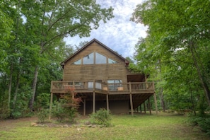 Oversized decks and tons of windows along the back of the cabin