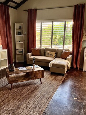 With a comfy couch, cozy decor, and plenty of natural light. 