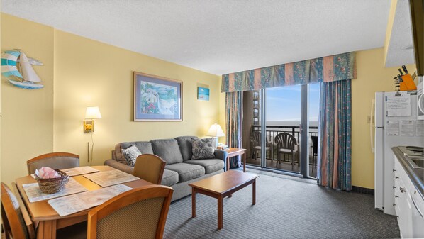 The ocean front living room is well-appointed with comfortable furnishings.