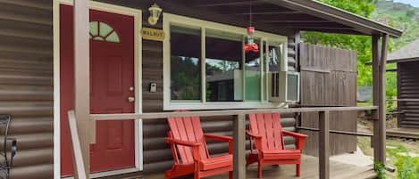 Welcome to the Walnut Cabin!  Enjoy your front porch relaxing with a book or watching the Hummingbirds