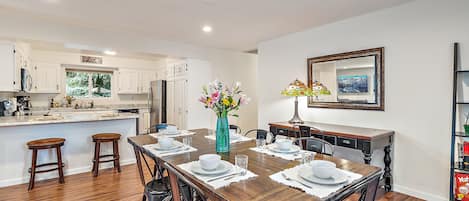 Large dining room table with 8 chairs. 