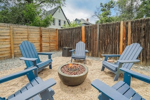 The private backyard has a picknick table, grill, and fire pit to enjoy the humidity and bug free Colorado nights