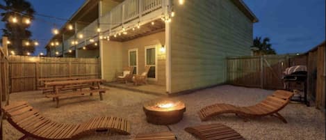 Lounge after a long beach day with the island breeze & fire pit in your backyard