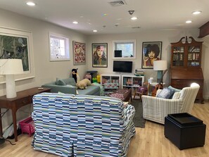 The sofa in the foreground is a twin sleeper.