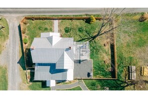 Birds-eye view of Casa Nube house, main yard, and side pergola/patio