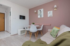 Relax in the stylish living room with a comfortable sofa and modern decor.