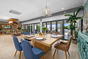 Comfortable dining area with great pool view.