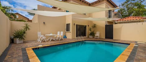 Large Pool with Shades and Outdoor Dining.