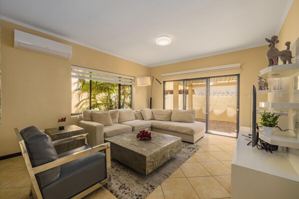 This living room space will let you enjoy your favorite movies while having snacks with your family.