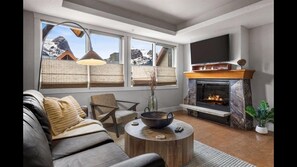 Livingroom - South facing Mountain Views with Electric Fireplace and TV