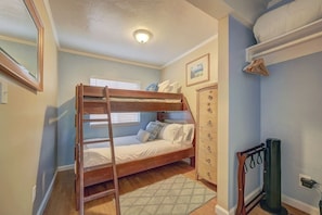 Second bedroom features bunk bed with  a twin on top and a full sized bed on bottom, sleeping a total of up to 3 people. 