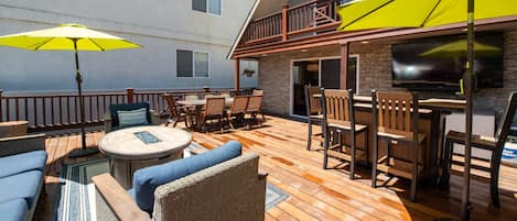 Large outdoor deck that welcomes you to the home