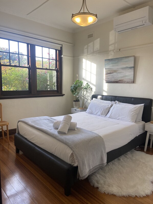 Front bedroom - lots of light, queen bed, lots of wardrobe space, phone charging