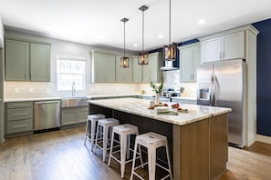 Open kitchen with lots of counter and storage space.