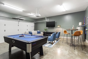 Rec room with a pool table.