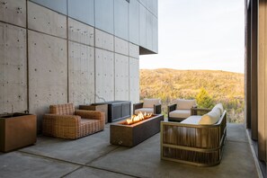 Relax in the inner courtyard with comfortable seating and an electric firepit.