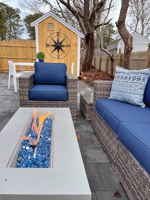 Outdoor patio with fire pit seating for 6 and outdoor dining for 6!