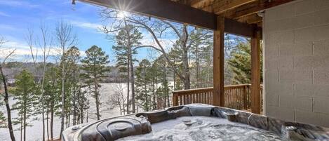 Relax and unwind in our lakeside hot tub, surrounded by the natural beauty of Bella Vista, Arkansas.