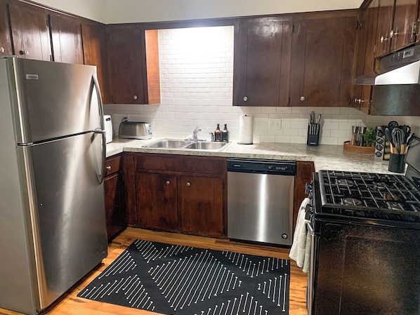 The open Kitchen features all of the major appliances & tools to cook a meal