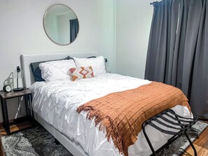 Charming Queen Bedroom, with Cozy Bedding and Blackout Curtains